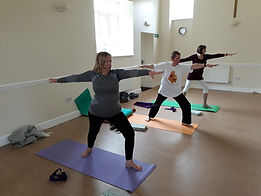 3 students in yoga pose